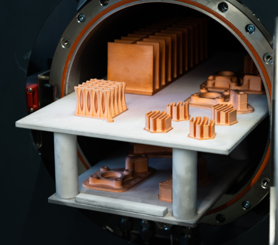 An assortment of copper Metal FFF 3D printed parts